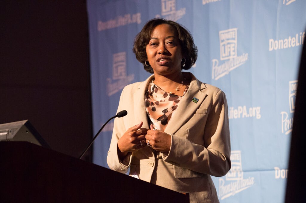 Laverne Clark speaks on stage at an event.