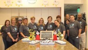 The team from AmeriHealth Caritas participates in Home Cook Heroes at Gift of Life Family House.