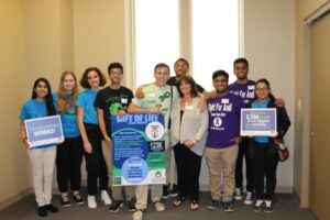 Students from George Washington H.S. with teacher and kidney transplant recipient, Andrea Seitchik