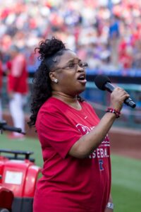 Gift of Life Donor Program Volunteer Ambassador Arlinda Griffin signs the national anthem at a Philadelphia Phillies game