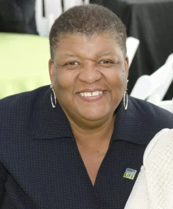 A woman smiles for the camera.