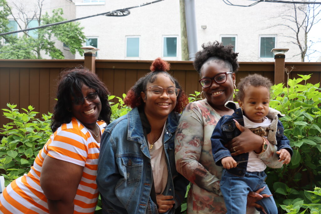 A family poses for a picture. 