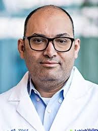 A doctor poses for a picture.