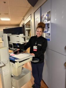 A doctor smiles for a photo.