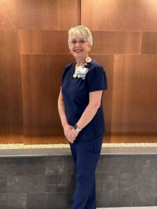 A hospital professional poses for a photo.