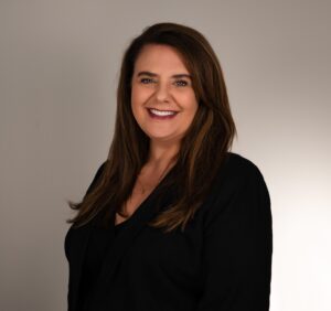 A woman poses for a photo.