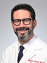 A doctor poses for a picture.