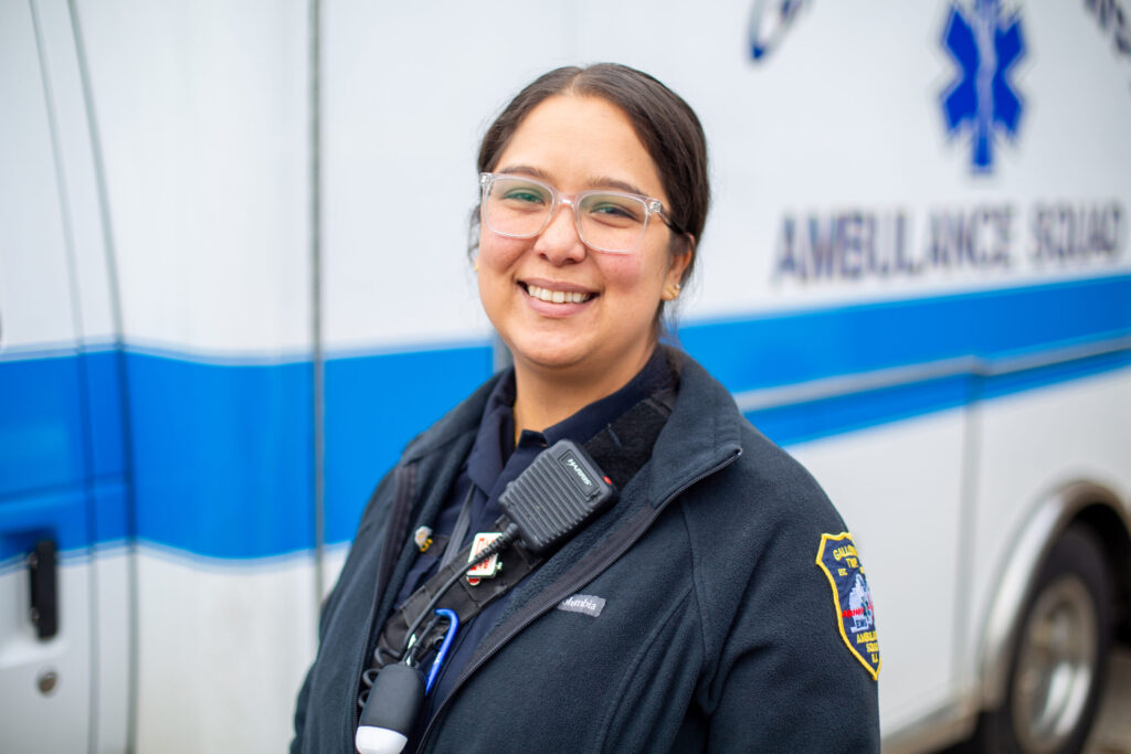 An EMT smiles for a photo.