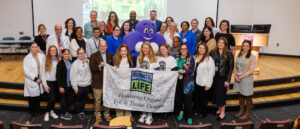 Temple Health and Gift of Life staff pose for a picture during National Donate Life Month with transplant recipients and donor families.