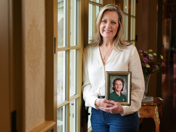 Melanie Penna holds a portrait of her late son and organ donor Anthony.