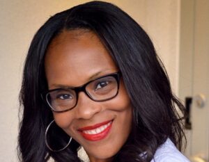 Charlita Davis smiles for a photo.