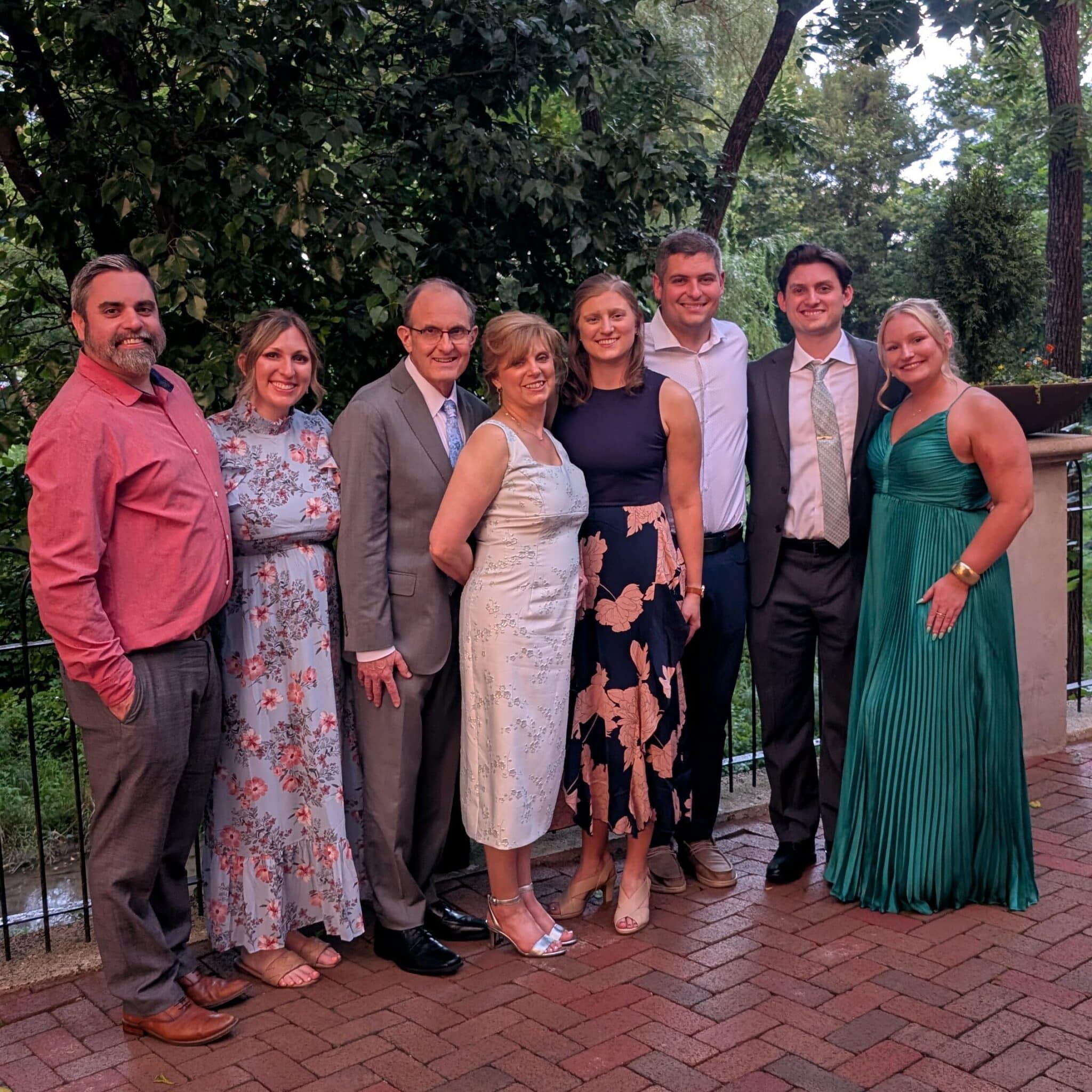 Tom poses for a wedding photo with family.
